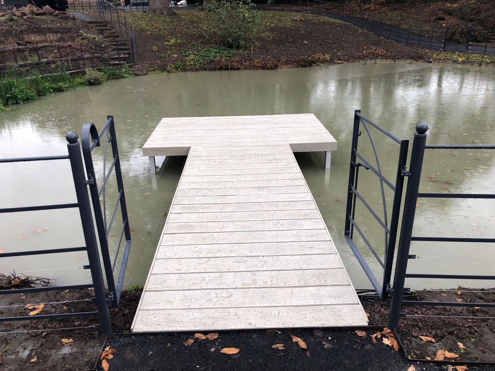 Pond with composite swim jetty